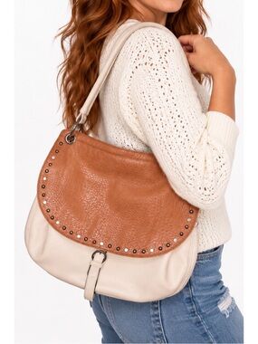 Two-tone shoulder bag featuring a warm cognac-brown front flap over a soft ivory